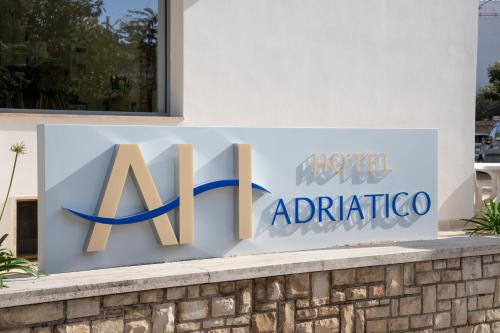 a sign for a hotel adidas articula on a building at Hotel Adriatico in Tricase