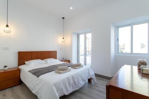 Cama ou camas em um quarto em Azores PDL House