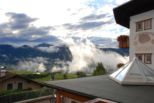 a view of the mountains from a balcony of a house at La Montanina Hotel in Val di Non in Malosco