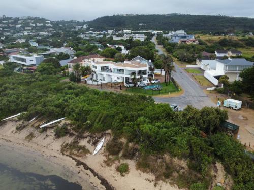an aerial view of a coastal town with houses at Sunshowers Plett in Plettenberg Bay