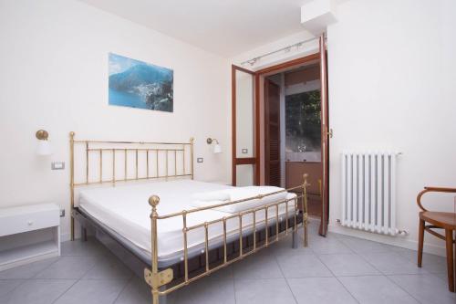 a bedroom with a bed and a glass door at N172 - Numana, meraviglioso trilocale con giardino in Sirolo