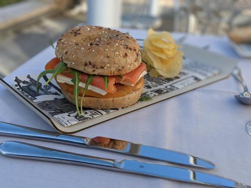a sandwich on a plate on a table at Hotel Attica21 Las Rozas in Las Rozas de Madrid