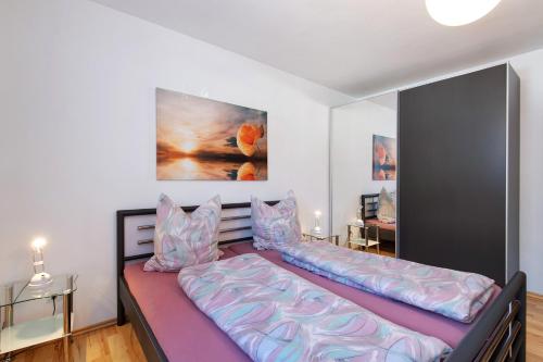a bedroom with a bed with pillows on it at Fewo Christina in Garmisch-Partenkirchen