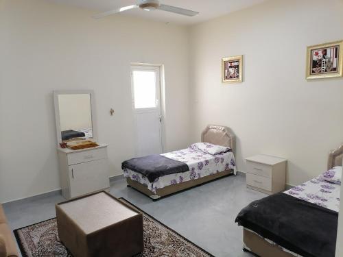 Giường trong phòng chung tại شاليهات الشاطيء beach chalets