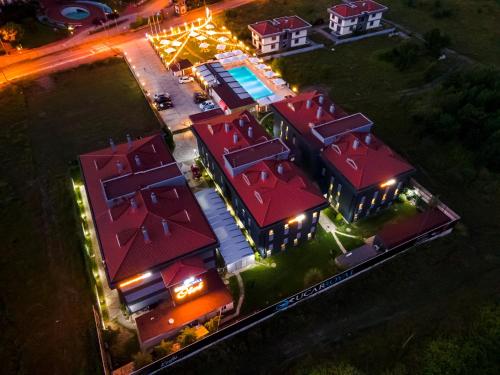 an overhead view of a building with red roofs at night at Uçar Royal Hotel ve Konferans Salonu in Sile
