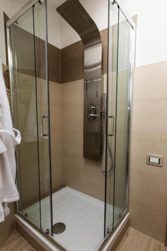 a shower with a glass enclosure in a bathroom at Diamond apartment Agerola in Agerola