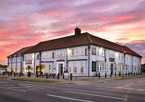 a large white building on the side of a street at Kingscliff, BW Signature Collection in Clacton-on-Sea