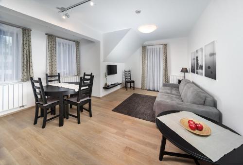 a living room with a couch and a table at Pension Valon in Špindlerův Mlýn