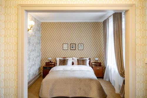 Кровать или кровати в номере Hotel H15 Francuski Old Town