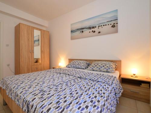 a bedroom with a bed and a picture of a beach at TOP-APARTMENT MONTENEGRO, with private Pool! in Kumbor
