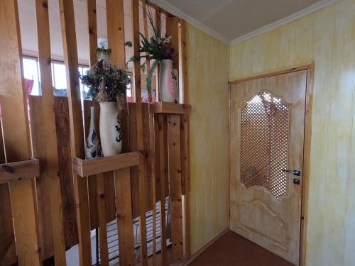 a room with a wooden door and a window at Guest House Zhelannyi in Feodosia