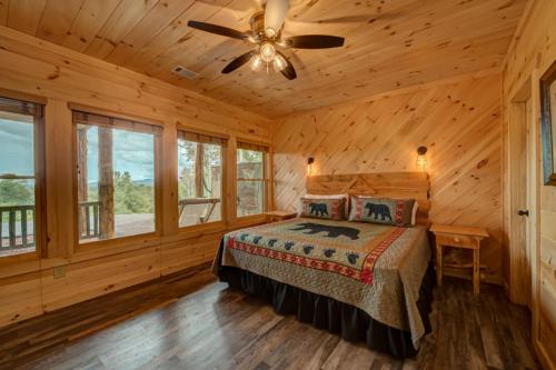 a bedroom with a bed and a ceiling fan at Serenity Peak in Blue Ridge