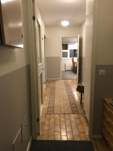 a hallway with a tile floor in a house at Villa Vankka in Pohjaslahti