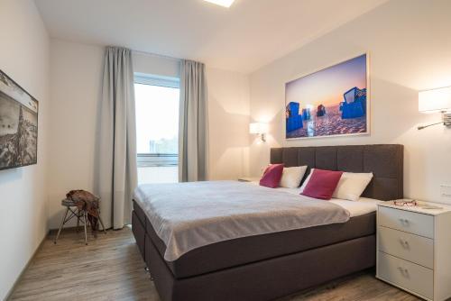 Säng eller sängar i ett rum på Appartement "Seeadler" - Oase am Haff