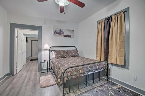 a bedroom with a bed and a ceiling fan at Uptown NOLA Abode, 4 Miles to the French Quarter! in New Orleans