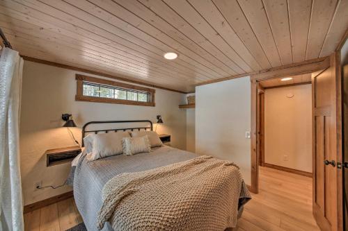 a bedroom with a bed in the middle of a room at Serene Kootenai Cabin - 3 Mi to Dtwn and River! in Bonners Ferry