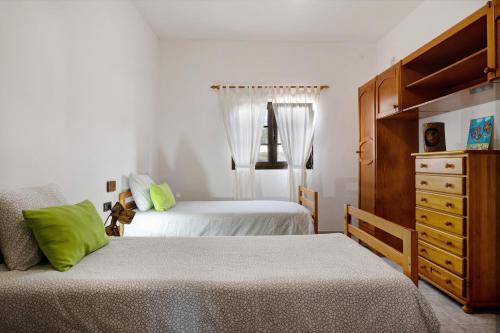 Llit o llits en una habitació de La Ratona