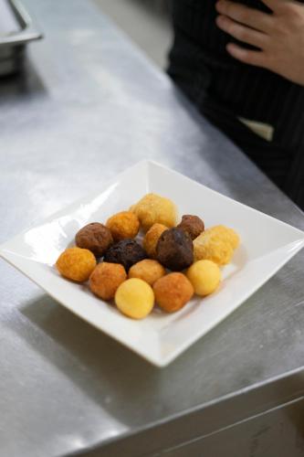 a white plate of food on a table at Il Semaforo Sila Hotel in Taverna