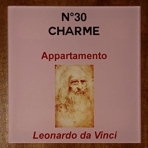 a sign with a picture of a painting of a man at N°30 CHARME Apartments in Vigevano