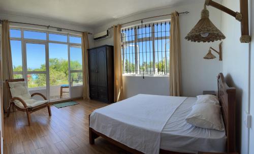 Postel nebo postele na pokoji v ubytování Suntoo Villa Wind & Kitesurf Accommodation