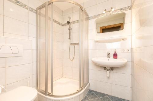 a bathroom with a shower and a sink and a toilet at holiday home, Strass im Zillertal in Strass im Zillertal