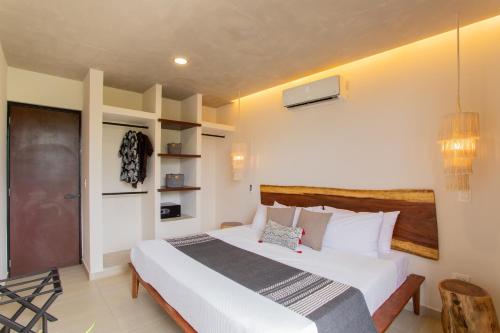 Cama o camas de una habitación en Macondo Tulum