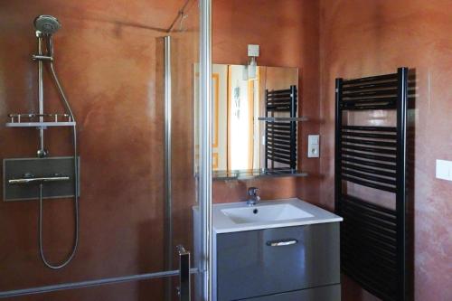 a bathroom with a sink and a shower at Holiday Home in Guerlesquin near Lake in Guerlesquin