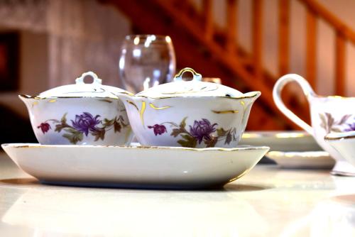 a tea set sitting on a table with a tea pot at אוויר הרים in Kefar Weradim
