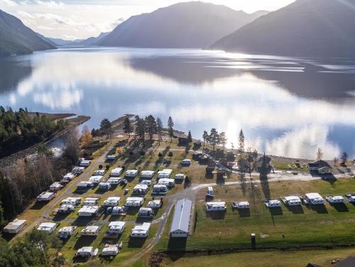 an aerial view of a parking lot next to a lake at Sandviken Camping in Austbygdi