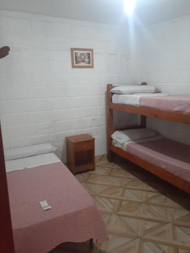 Un pat suprapus sau paturi suprapuse la Hostal Candelaria