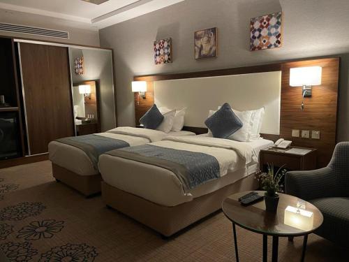 A bed or beds in a room at فندق ارض العسل بوتيك