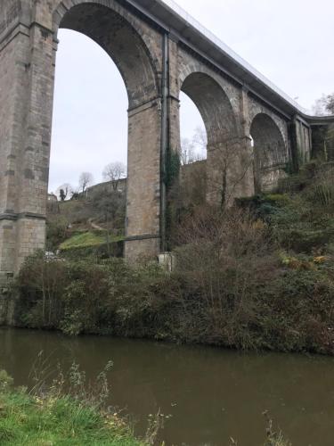 a bridge with three arches over a river at Bleu Outremer in Saint-Cast-le-Guildo