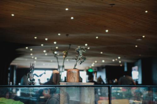a plant sitting on top of a table in a room at G1 Lodge in Baguio