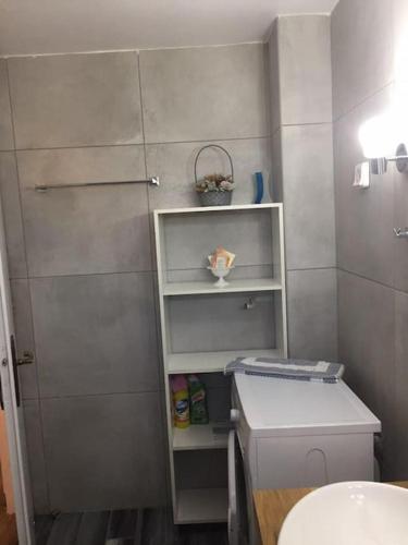 a small bathroom with a sink and a toilet at Diktynna villa in Palekastron