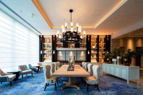 a dining room with a table and chairs at Premier Hotel CABIN PRESIDENT Osaka in Osaka