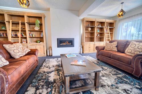 a living room with two couches and a coffee table at Albany Motel & Apartments in Albany