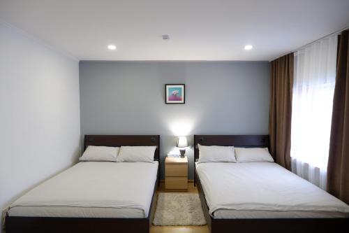 Mina Hotel tesisinde bir odada yatak veya yataklar