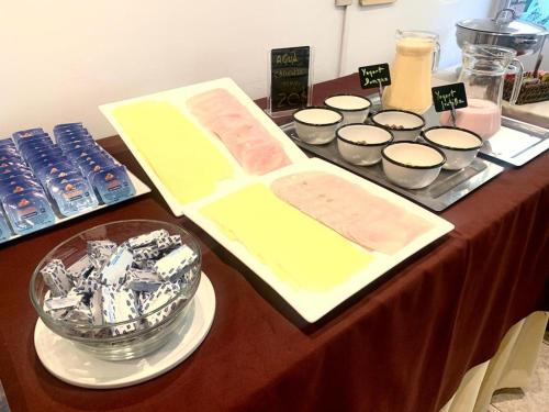 a table topped with a table with food and other foods at Hotel Alhambra in Punta del Este