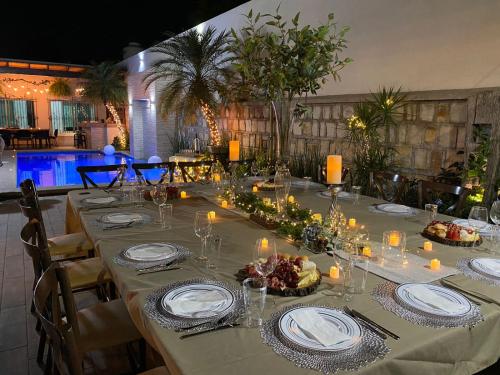 a table set up for a dinner at a restaurant at Casa AMMAH in Ciudad Valles