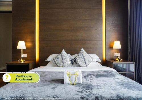 Ένα ή περισσότερα κρεβάτια σε δωμάτιο στο 7Stonez Suites Geo38 Genting Highlands