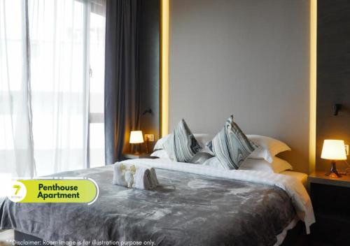 Ένα ή περισσότερα κρεβάτια σε δωμάτιο στο 7Stonez Suites Geo38 Genting Highlands