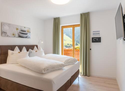 Кровать или кровати в номере Residence Töglhof