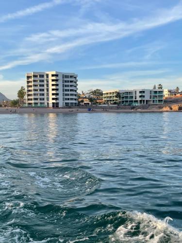 a view of a body of water with buildings in the background at Condominio Posada 314 San Carlos in San Carlos
