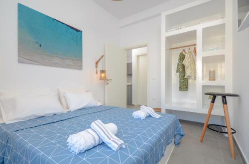 A bed or beds in a room at Aegean Jasmine - In The Center