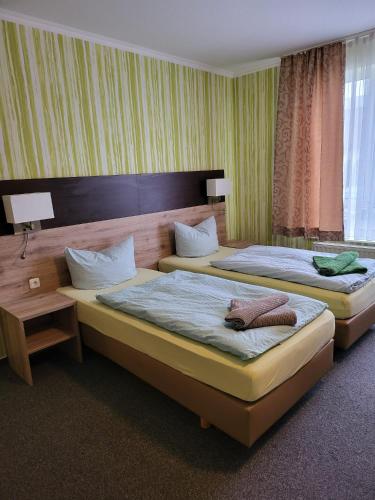 Katil atau katil-katil dalam bilik di Appart Hotel Roßdorf