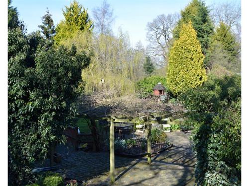 an overhead view of a garden with a pergola at Laburnum Cottage Guest House in Knutsford