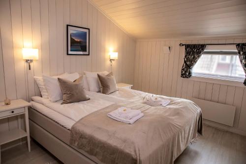 Tempat tidur dalam kamar di Gamlebyen Hotell - Fredrikstad