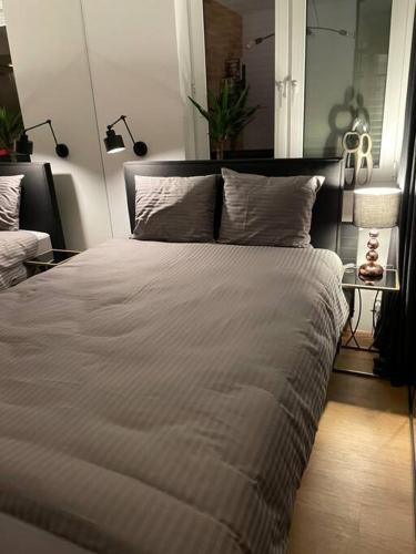 Posteľ alebo postele v izbe v ubytovaní LOFT Mickiewicza