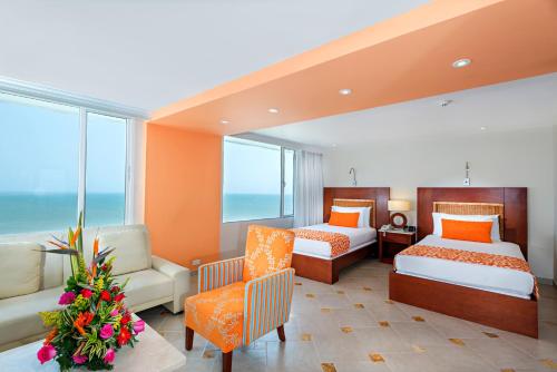 Postel nebo postele na pokoji v ubytování Hotel Dann Cartagena