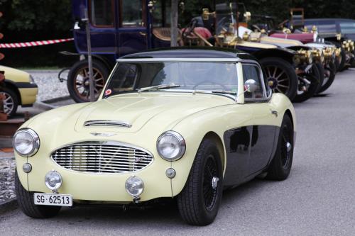 an old white car is parked on a street at Swiss Heidi Hotel in Maienfeld